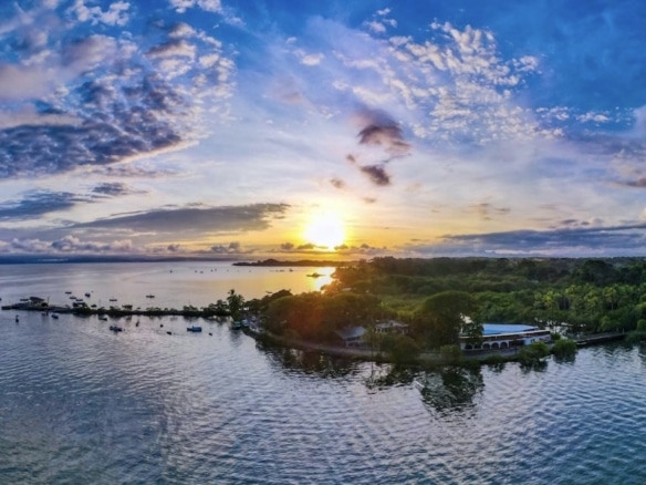 Harbor in Puerto Jiménez, Costa Rica showing boats and waterfront access for real estate buyers