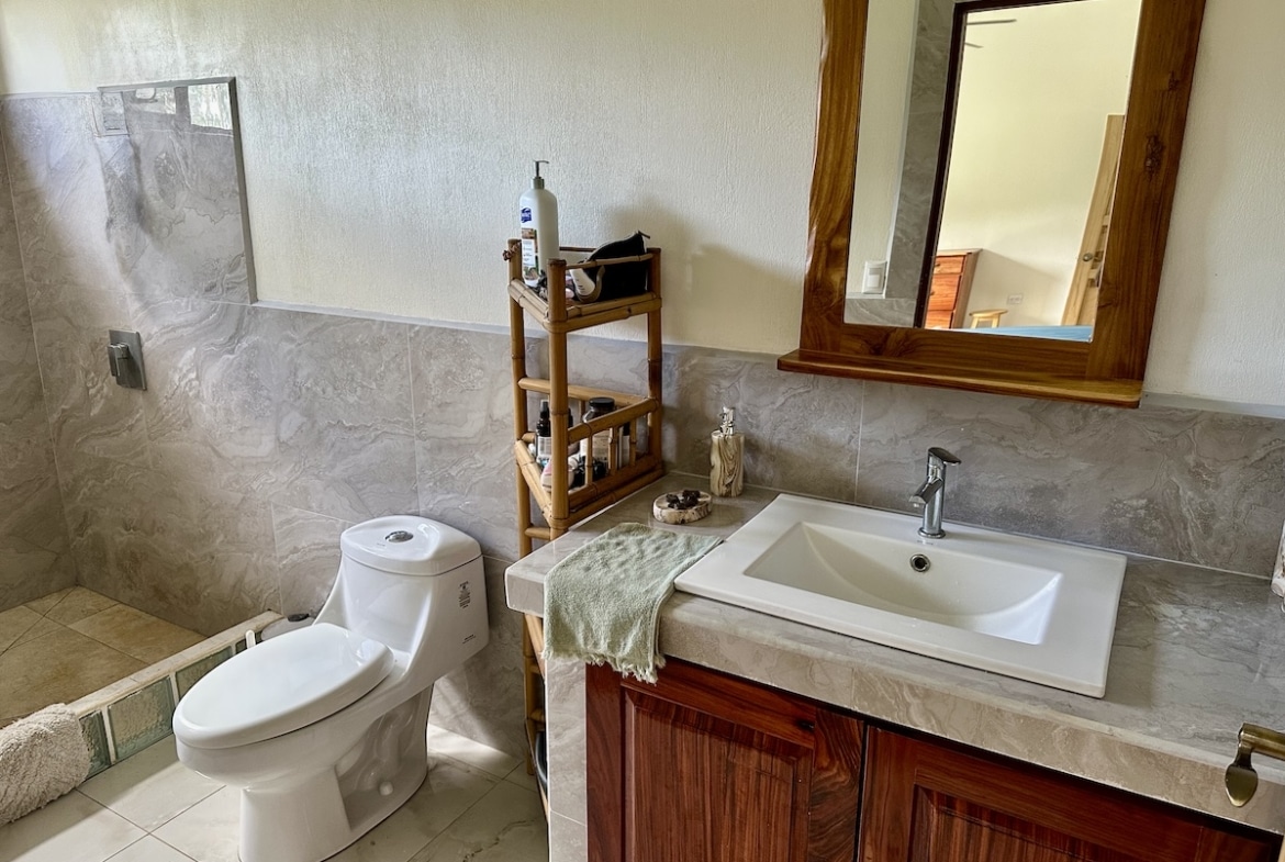 Elegant tiled bathroom with walk-in shower | Costa Rica property
