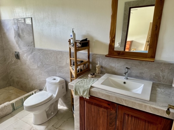 Elegant tiled bathroom with walk-in shower | Costa Rica property