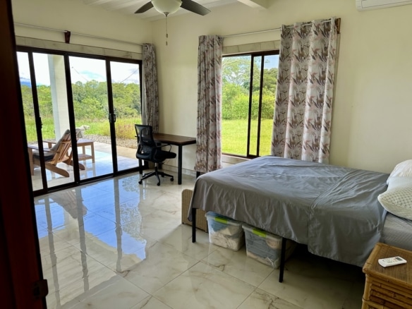 Bright bedroom with forest view | Osa Peninsula home