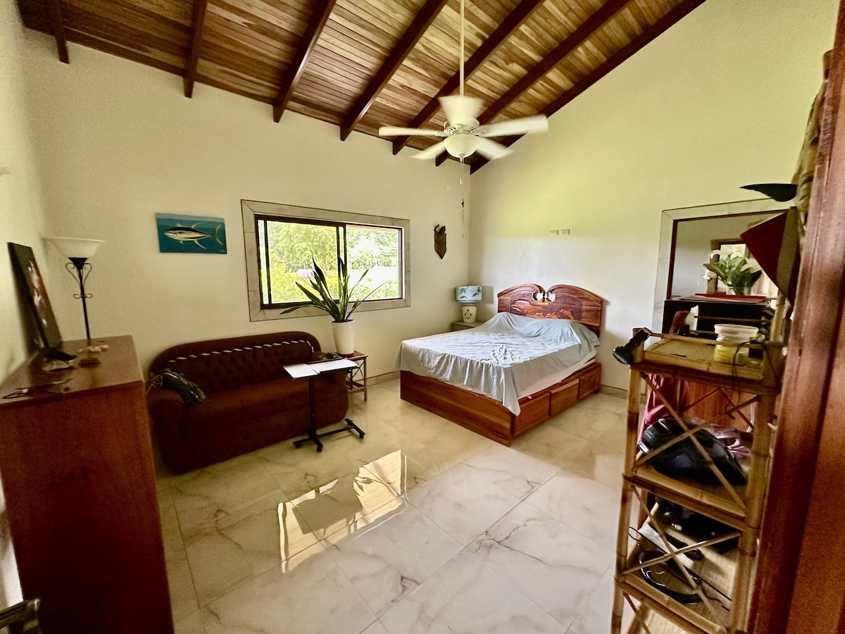 Comfortable bedroom in private Osa community home