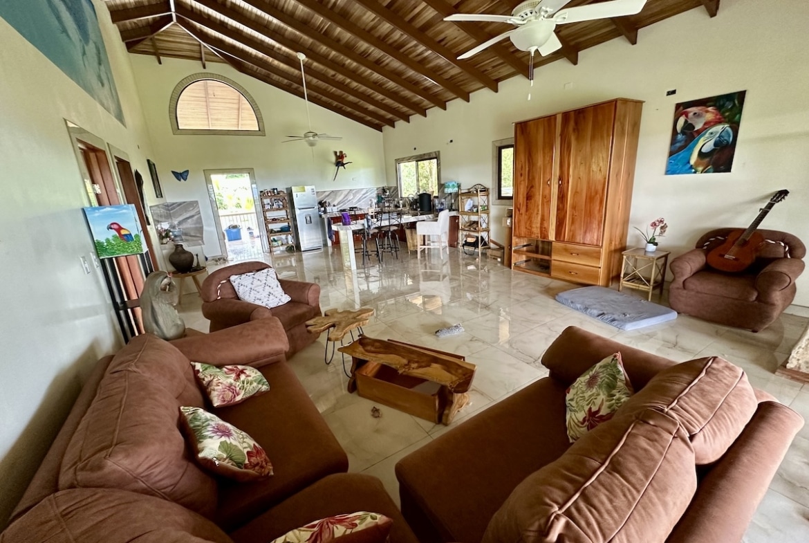 Tropical-inspired living room inside two-story duplex near Corcovado National Park, Osa Peninsula.