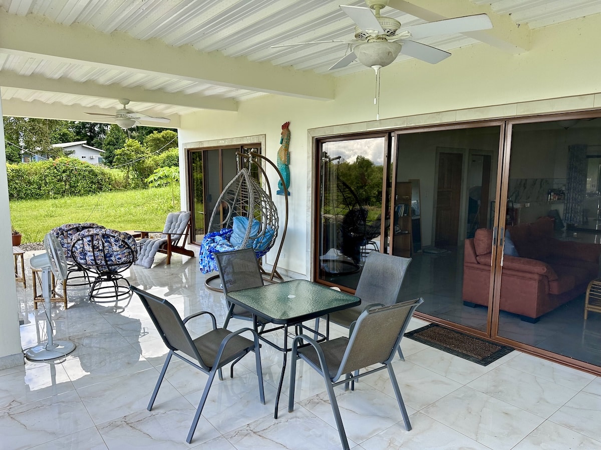 Osa Peninsula home for sale with lush tropical landscape and gated entrance